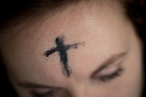 image of charcoal ash cross on forehead