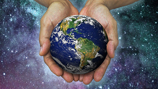 image of hands holding world with starry background