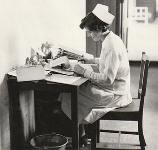 photo of nurse at desk