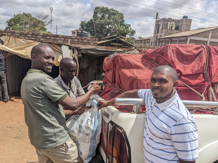 photo of men loading supplies into truck in Kenya