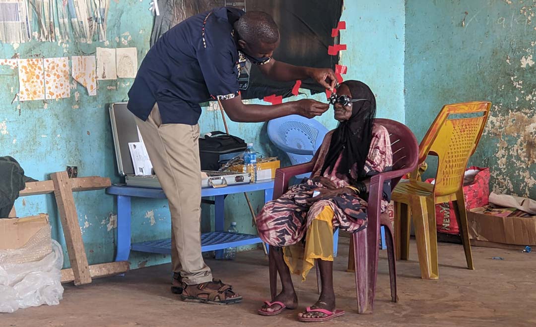 Patient being fitted with eyeglasses at eye clinic in Kenya
