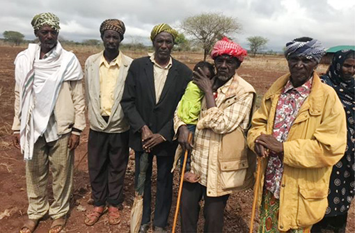five sheikhs in Kenya, wearing Western style clothes with turbans on heads