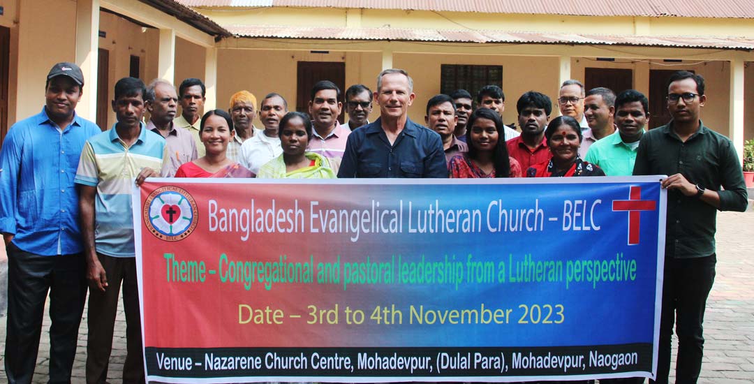 group of people holding banner