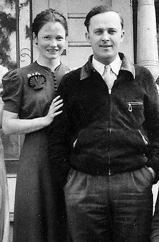 woman standing slightly behind man