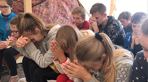 group of children praying