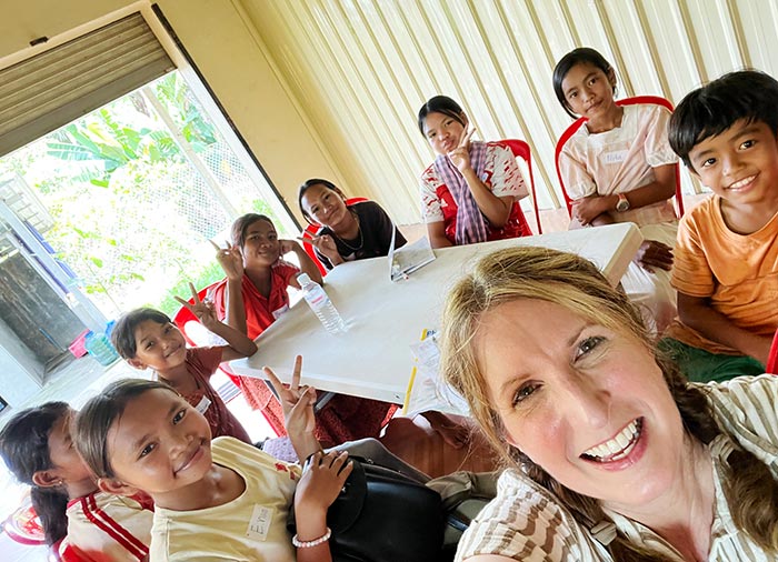 students with teacher in classroom