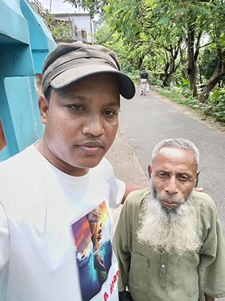 two men standing by road