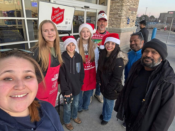 group of people working as bellringers for the Salvation Army