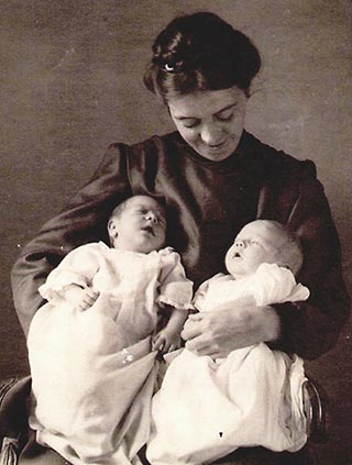 vintage photo of missionary in India holding two babies