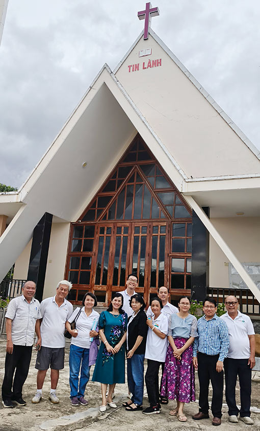 medical personnel in front of church in Vietnam