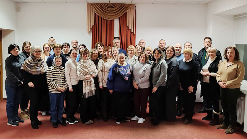 conference attendees posing for group photo