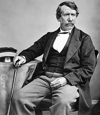 vintage photo of man seated by table