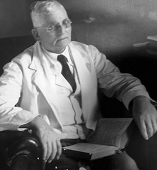 seated man wearing white shirt and jacket