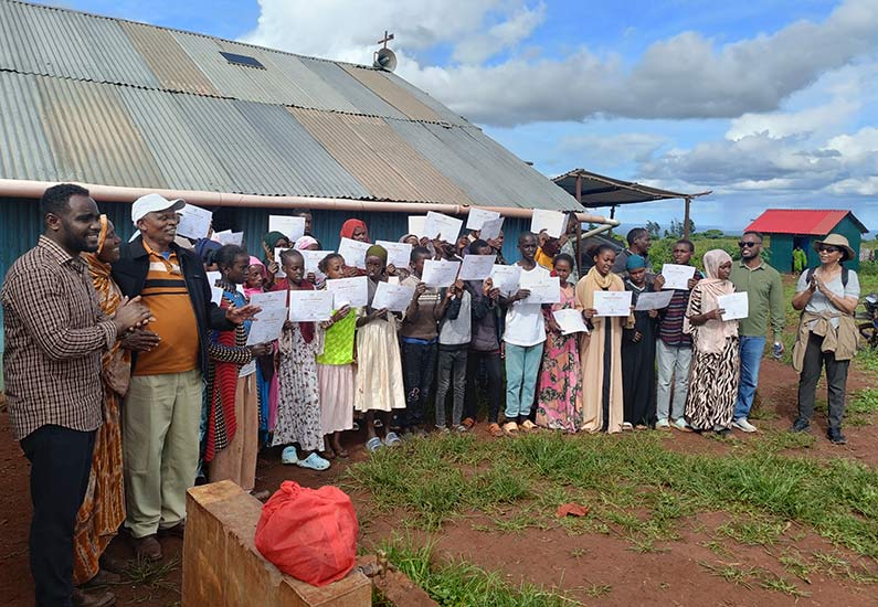 group of people standing in front of their church in Kenya