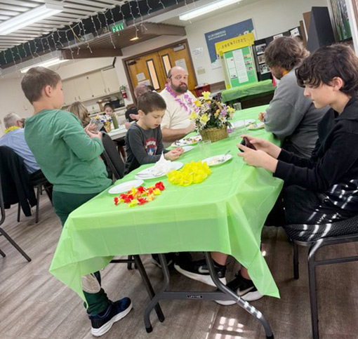 children looking at items on display table
