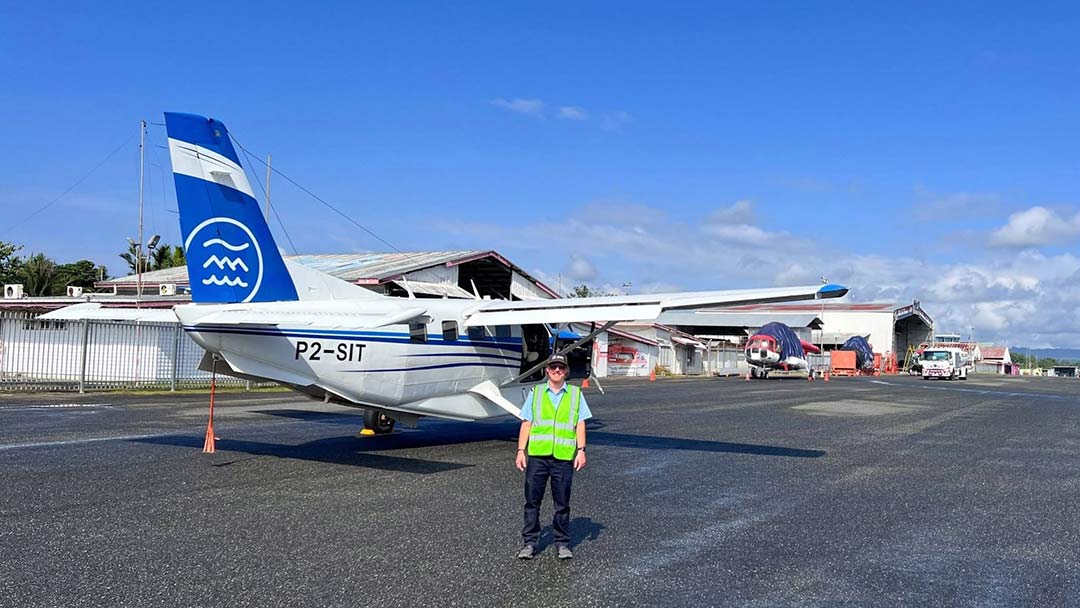 pilot standing by small aircraft
